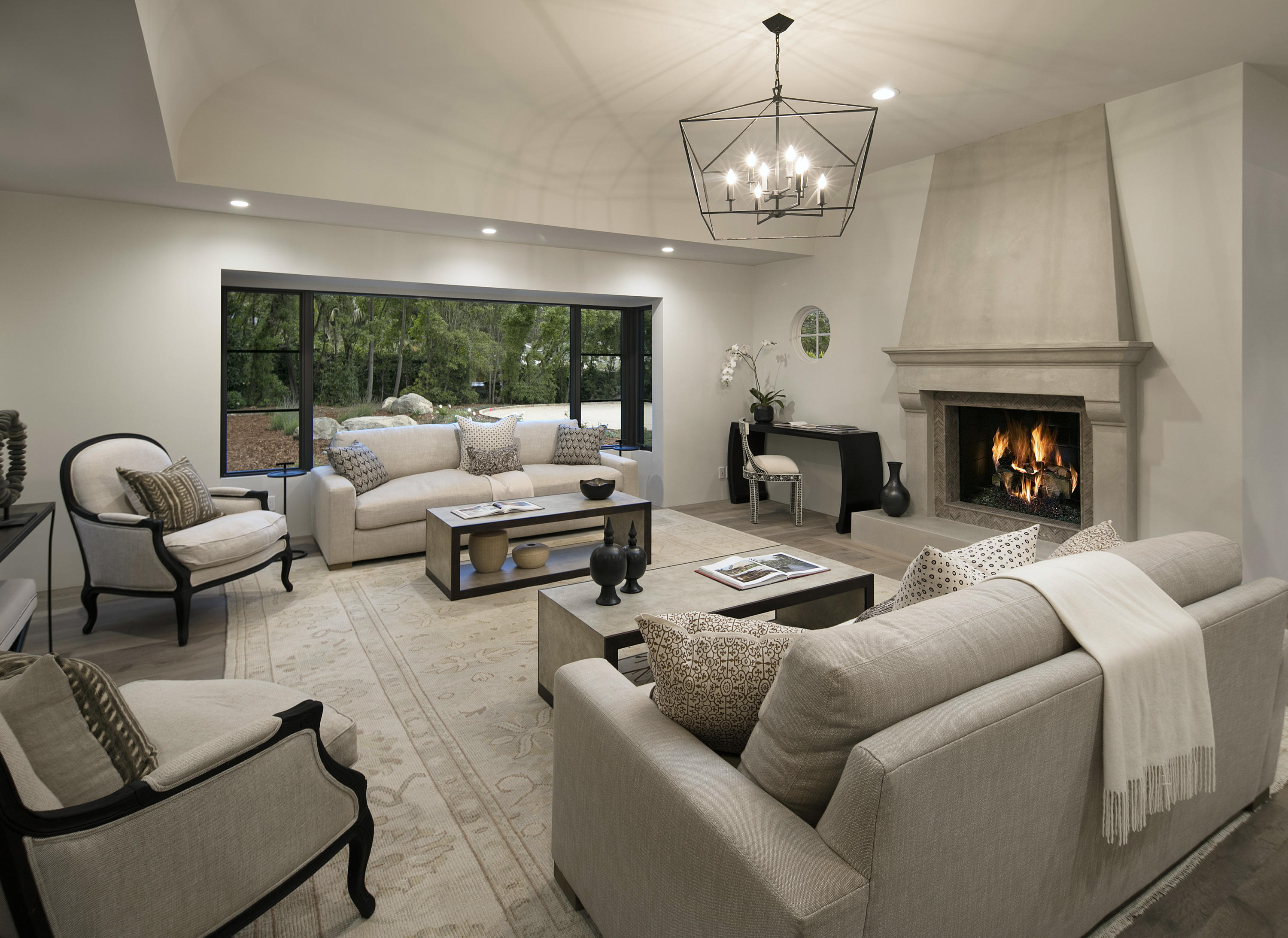 2740 Sycamore Canyon Road Montecito, CA 93108 - Photo 5 of 19 a living room with furniture a fireplace and a chandelier