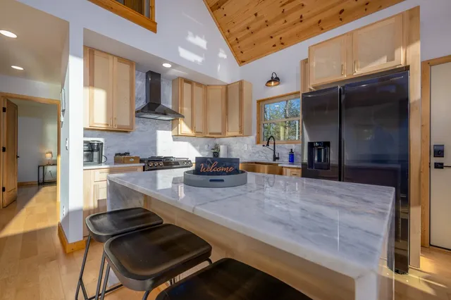 a kitchen with a stove and a refrigerator