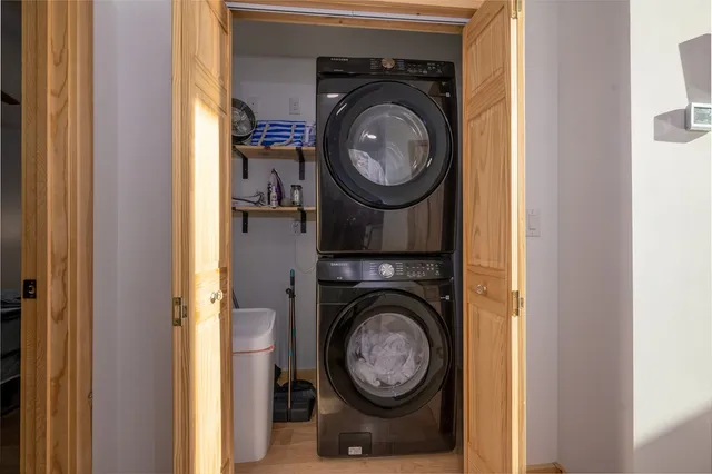 a view of a hallway with washer and dryer