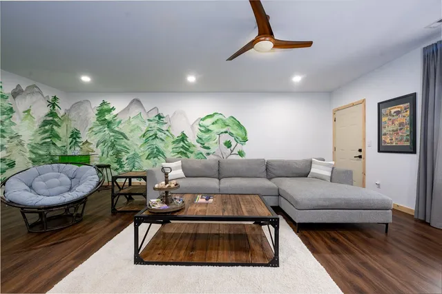a living room with furniture and a rug
