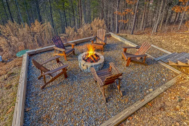 an aerial view of a backyard with chairs