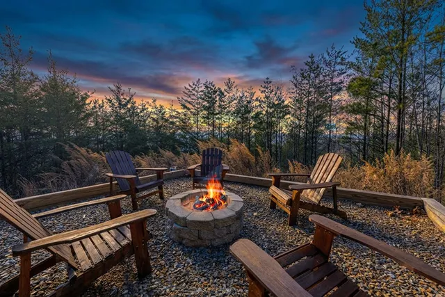 a view of a chairs and fire pit in the balcony