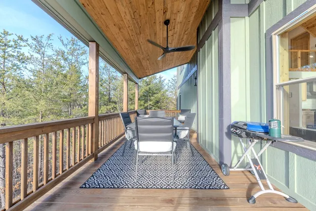 a view of two chairs in the balcony