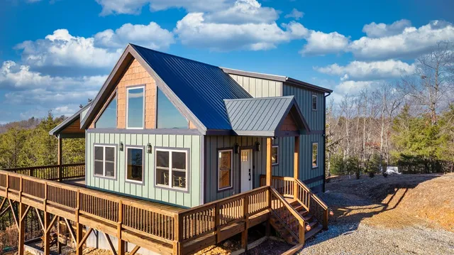 a front view of a house with a yard balcony