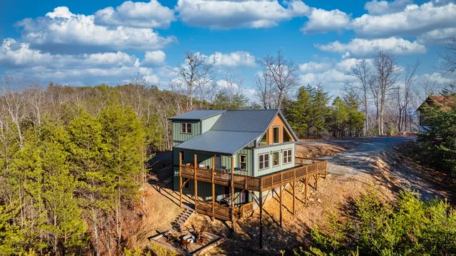 a view of a house with roof deck front of house