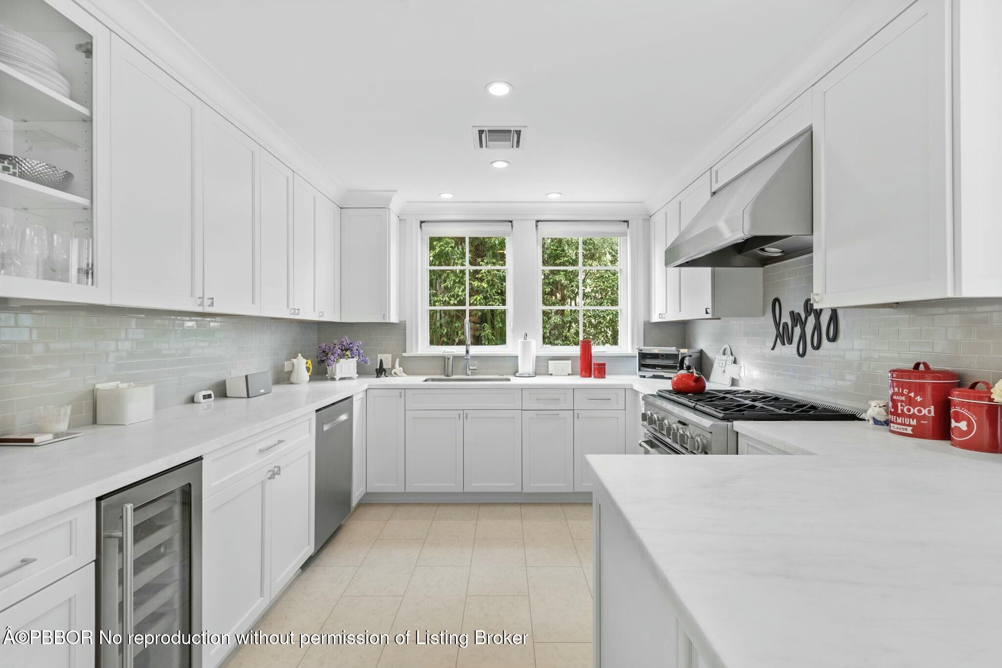 281 Cordova Road West Palm Beach, FL 33401 - Photo 13 of 25 a kitchen with a sink a window and cabinets