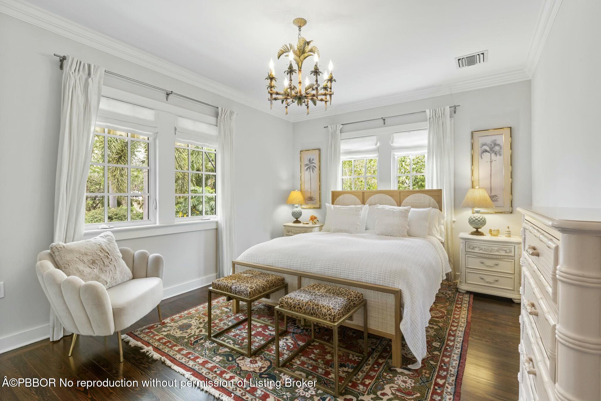 281 Cordova Road West Palm Beach, FL 33401 - Photo 22 of 25 a spacious bedroom with a bed and a chandelier