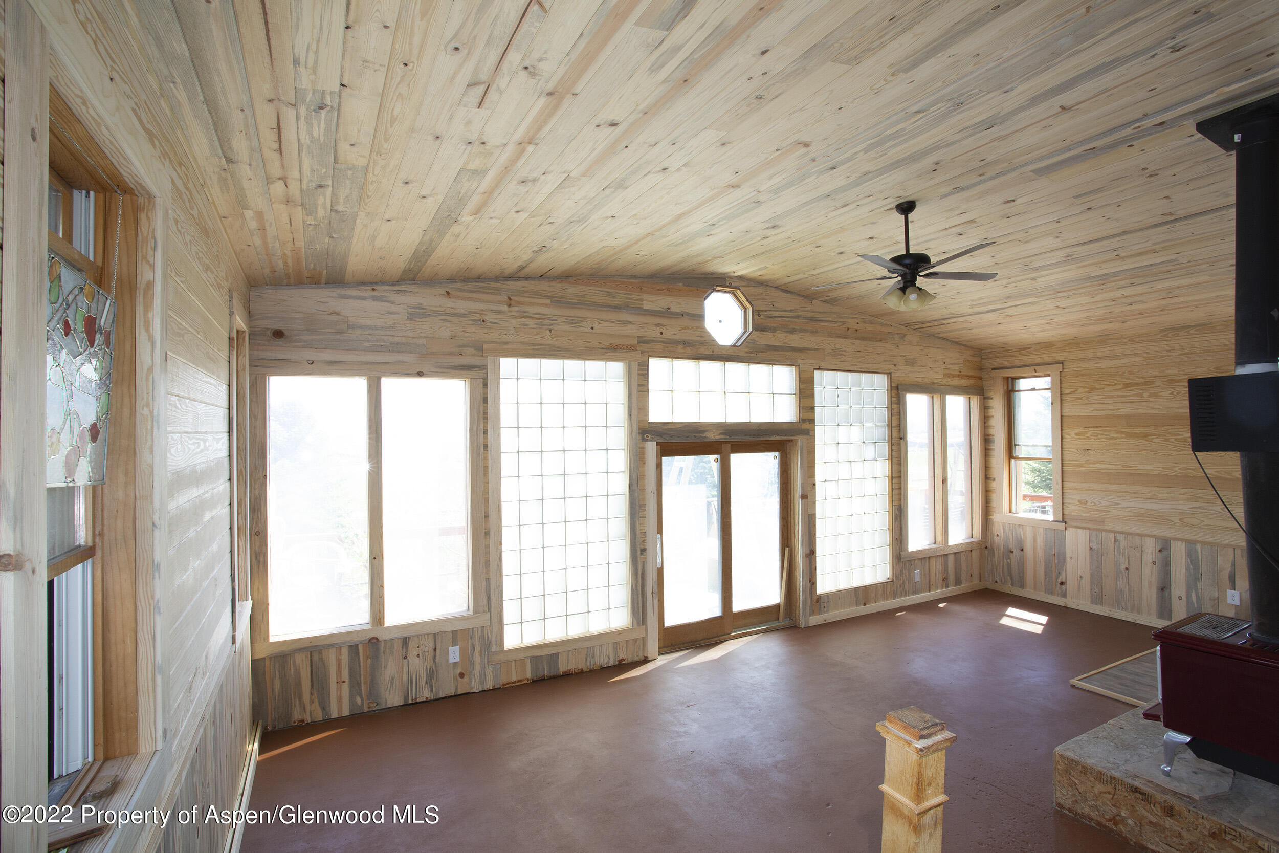 1407 County Road 237 Silt, CO 81652 - Photo 13 of 32 a view of an empty room with wooden floor and a window