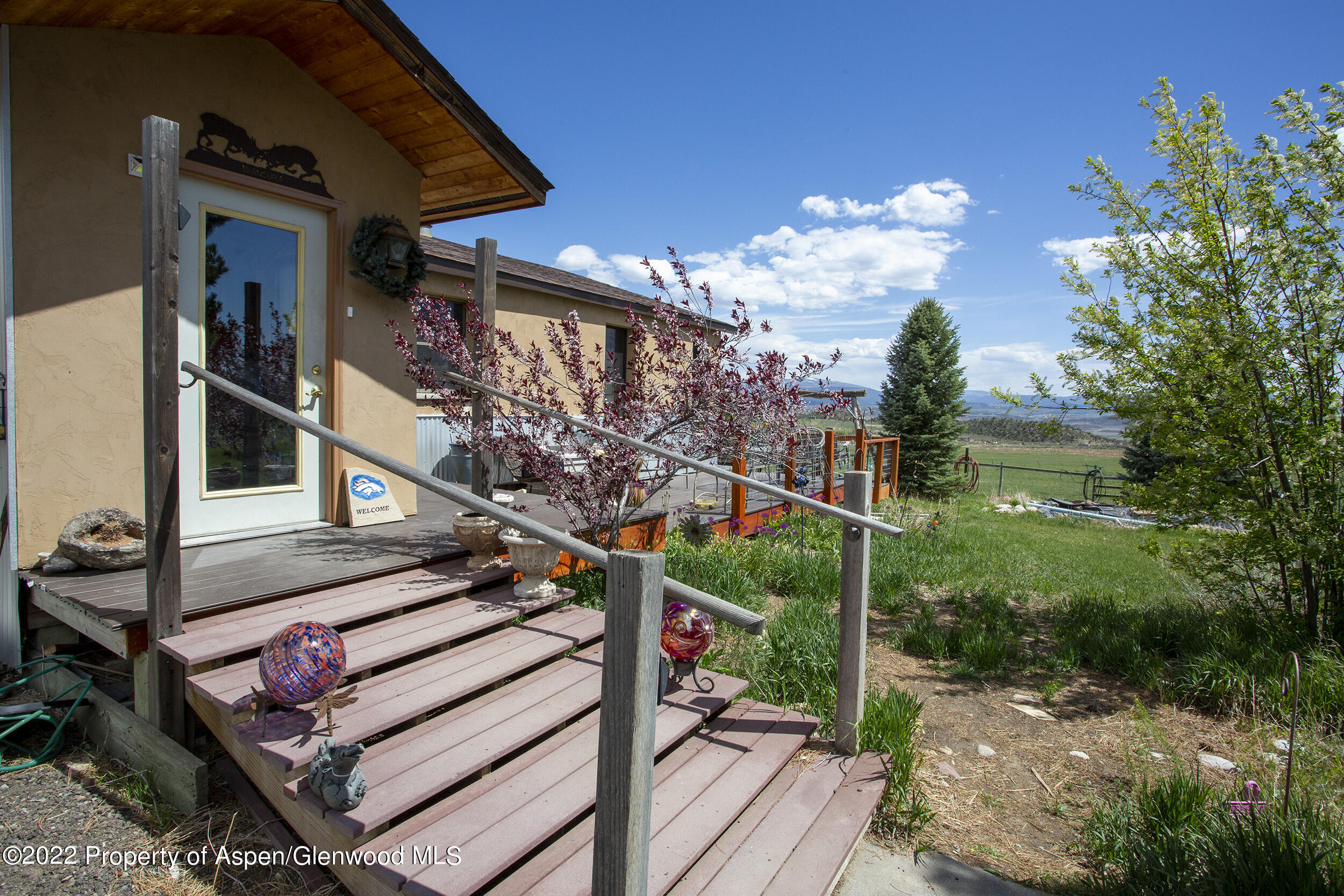 1407 County Road 237 Silt, CO 81652 - Photo 2 of 32 a view of a house with a small yard and wooden floor and fence