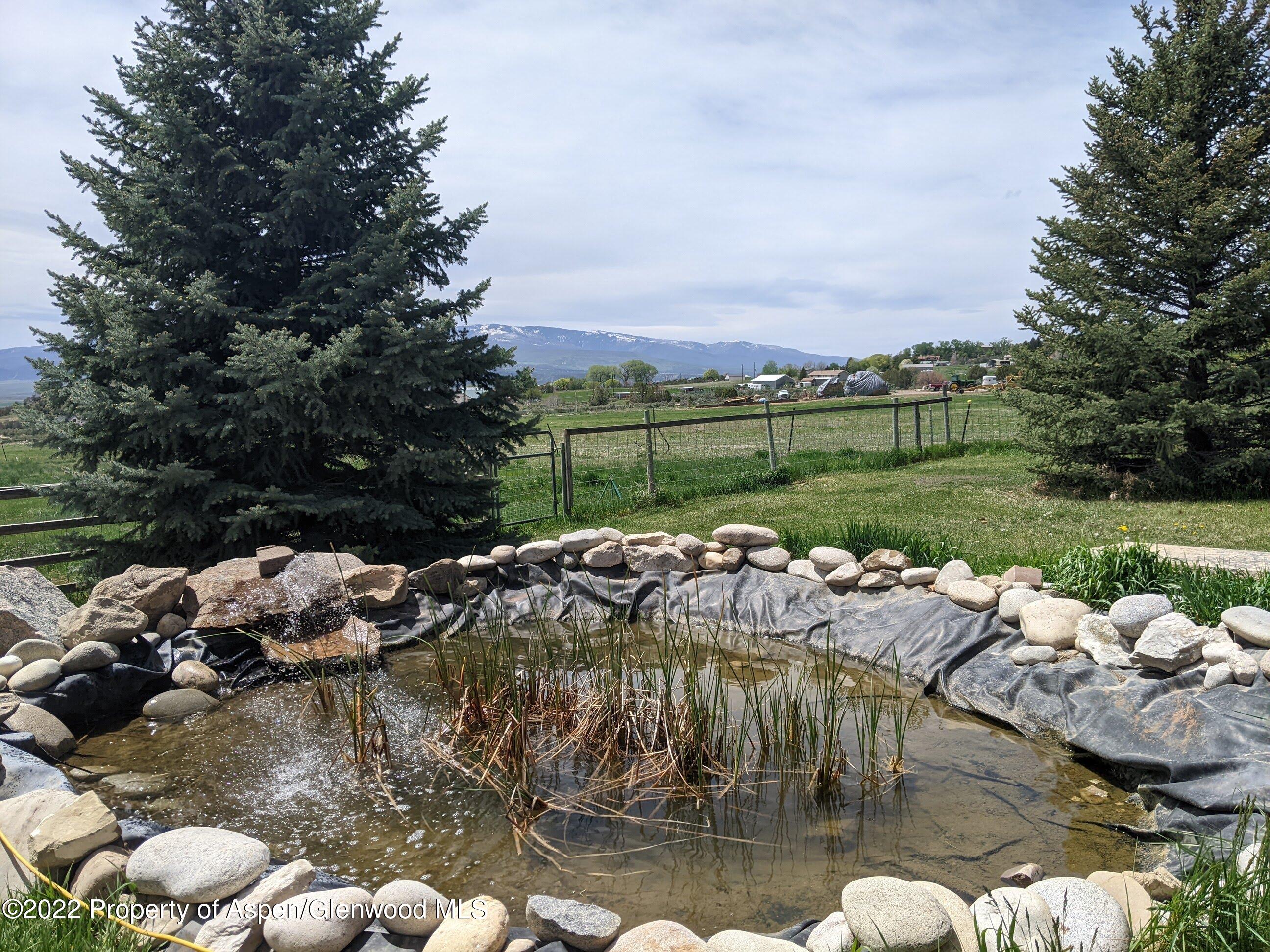 1407 County Road 237 Silt, CO 81652 - Photo 23 of 32 a view of a lake with couches and city view