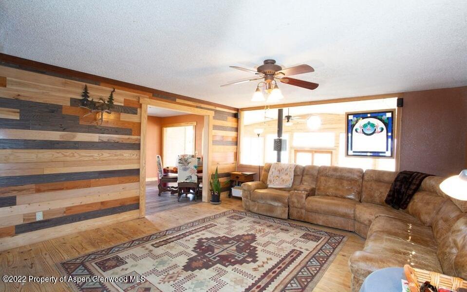 1407 County Road 237 Silt, CO 81652 - Photo 7 of 32 a living room with furniture and a large window