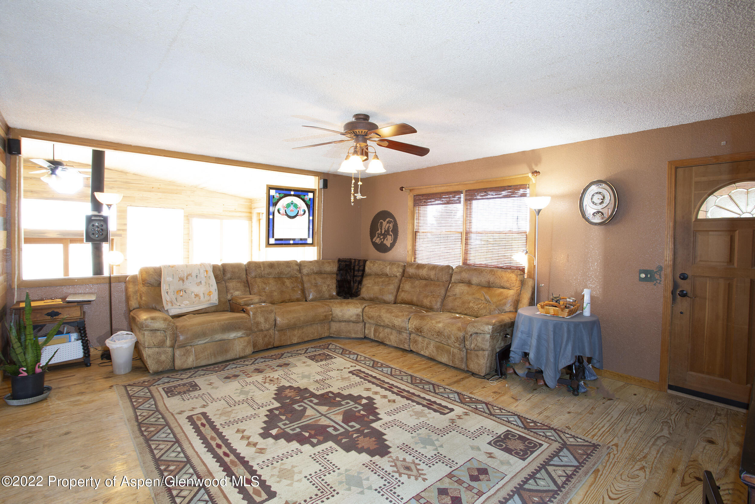 1407 County Road 237 Silt, CO 81652 - Photo 9 of 32 a living room with furniture and a large window
