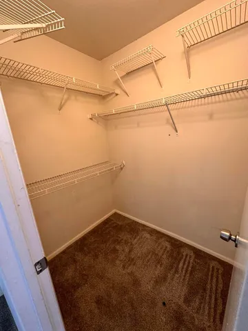 a view of a room with racks on the wall