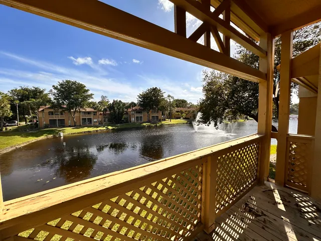 a view of swimming pool from a balcony