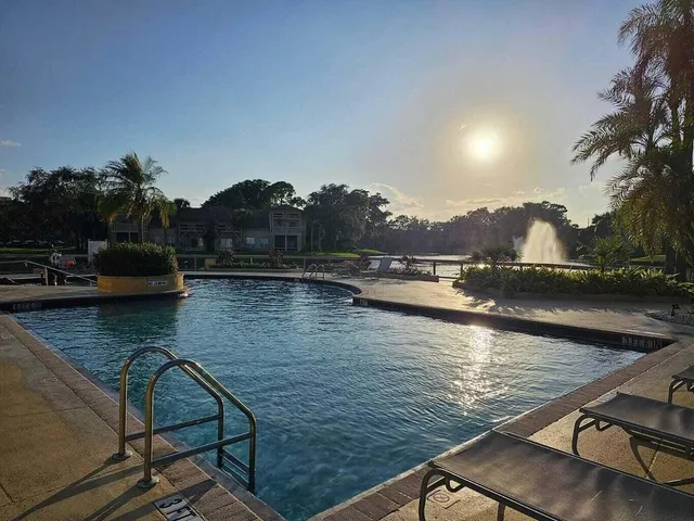 a view of swimming pool with outdoor seating