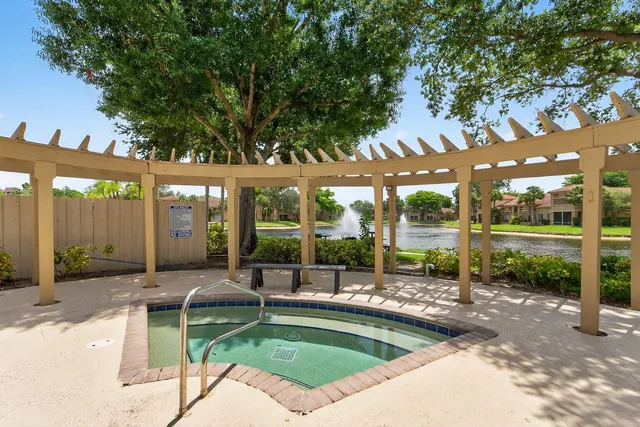an outdoor space with furniture and garden