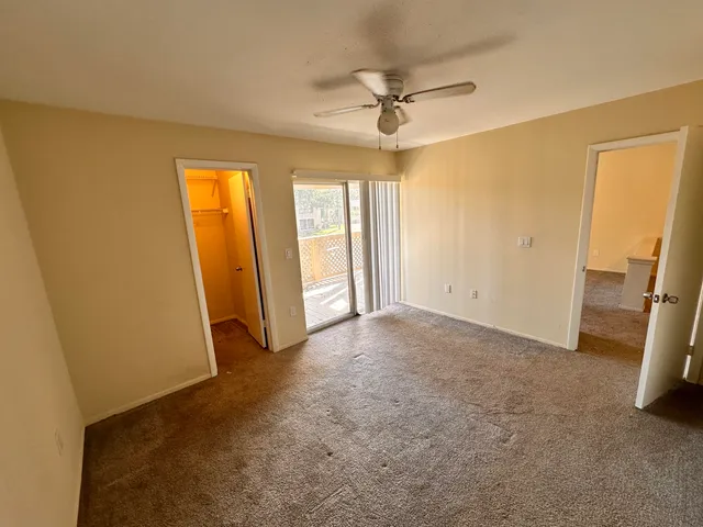 an empty room with windows and entrance