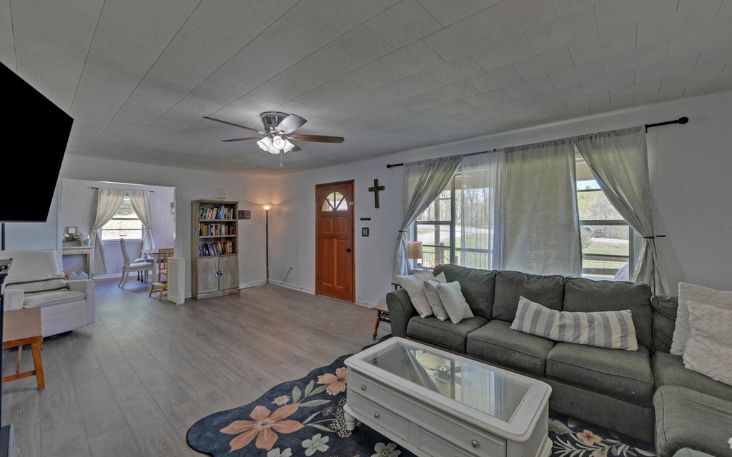 810 Grassy Creek Road Copperhill, TN 37317 - Photo 3 of 33 a living room with furniture and a flat screen tv