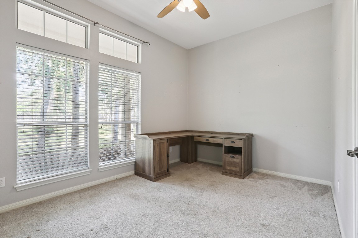 120 Juniper Trail Elgin, TX 78621 - Photo 18 of 32 Unfurnished office with light carpet and a ceiling fan