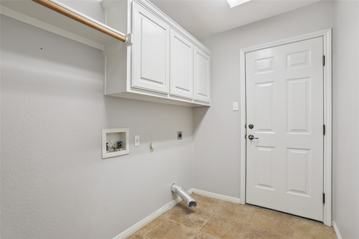 120 Juniper Trail Elgin, TX 78621 - Photo 22 of 32 Laundry room featuring hookup for a gas dryer, hookup for a washing machine, cabinet space, and hookup for an electric dryer