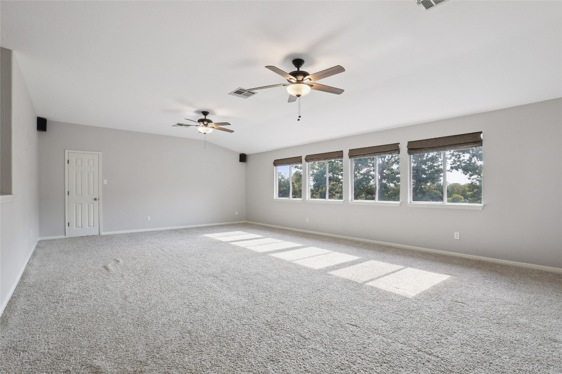 120 Juniper Trail Elgin, TX 78621 - Photo 24 of 32 Carpeted bonus room featuring ceiling fan and baseboards