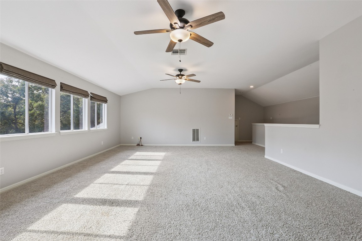 120 Juniper Trail Elgin, TX 78621 - Photo 25 of 32 Bonus room featuring lofted ceiling, carpet flooring, and ceiling fan