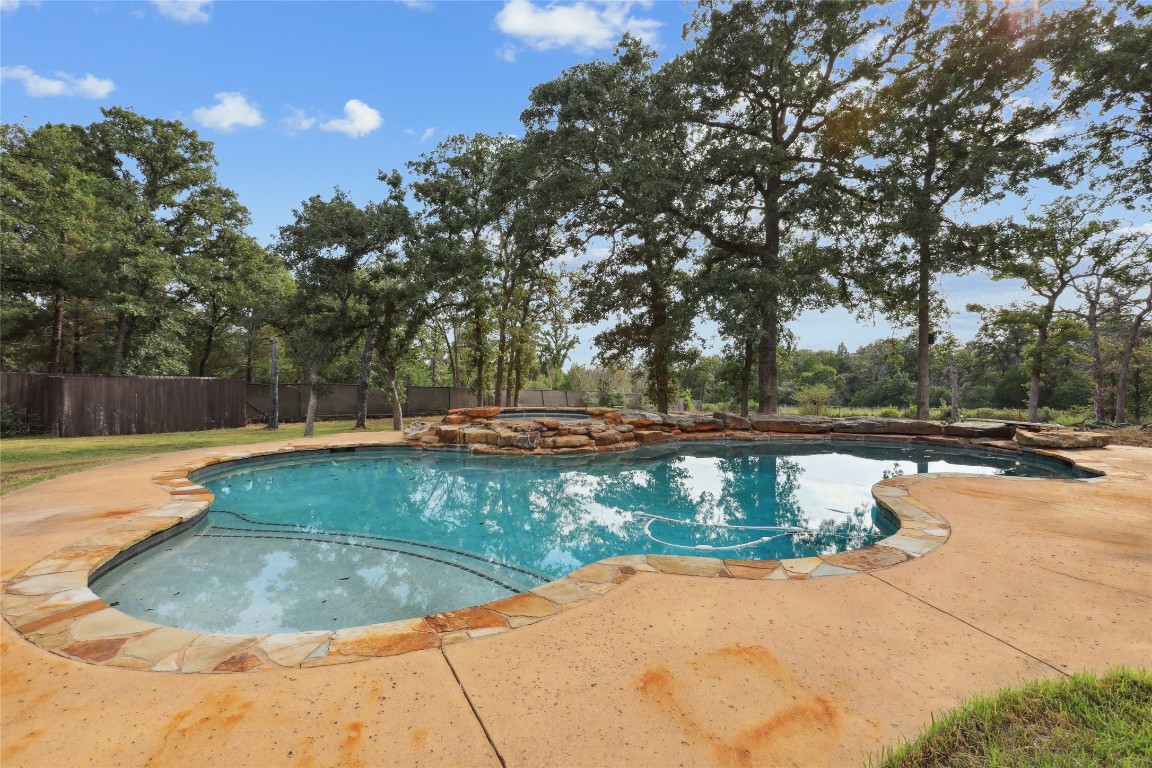 120 Juniper Trail Elgin, TX 78621 - Photo 28 of 32 View of pool featuring a pool with connected hot tub and a patio