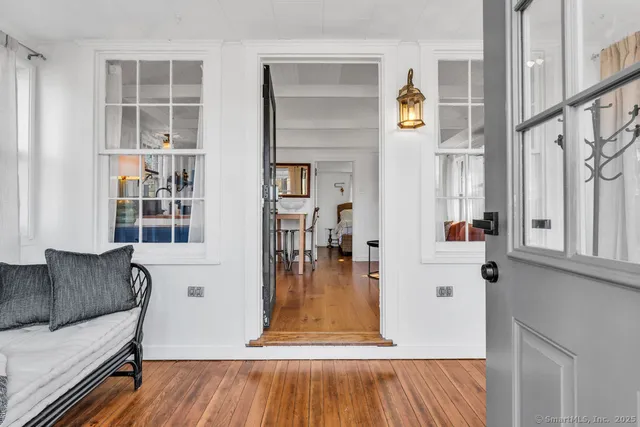 a view of a living room and entry way