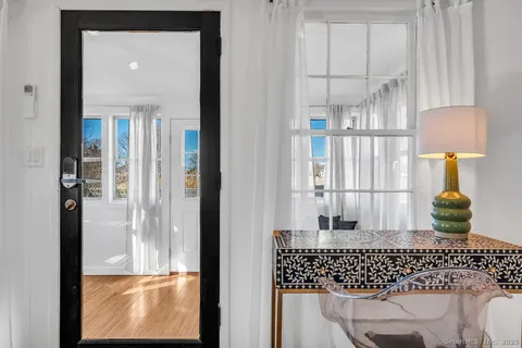 a window and a table in a balcony