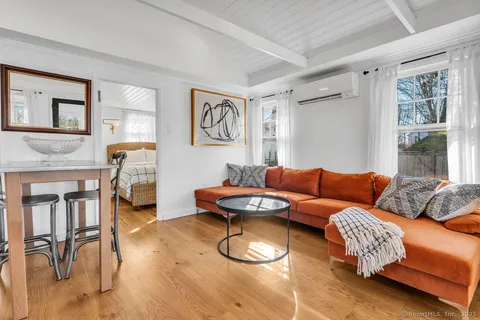 a living room with furniture and a table