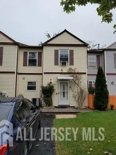 a front view of house with yard and outdoor seating
