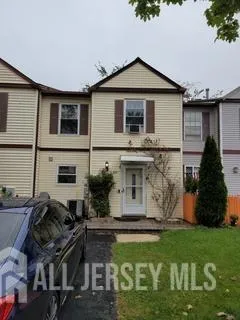 a front view of house with yard and outdoor seating