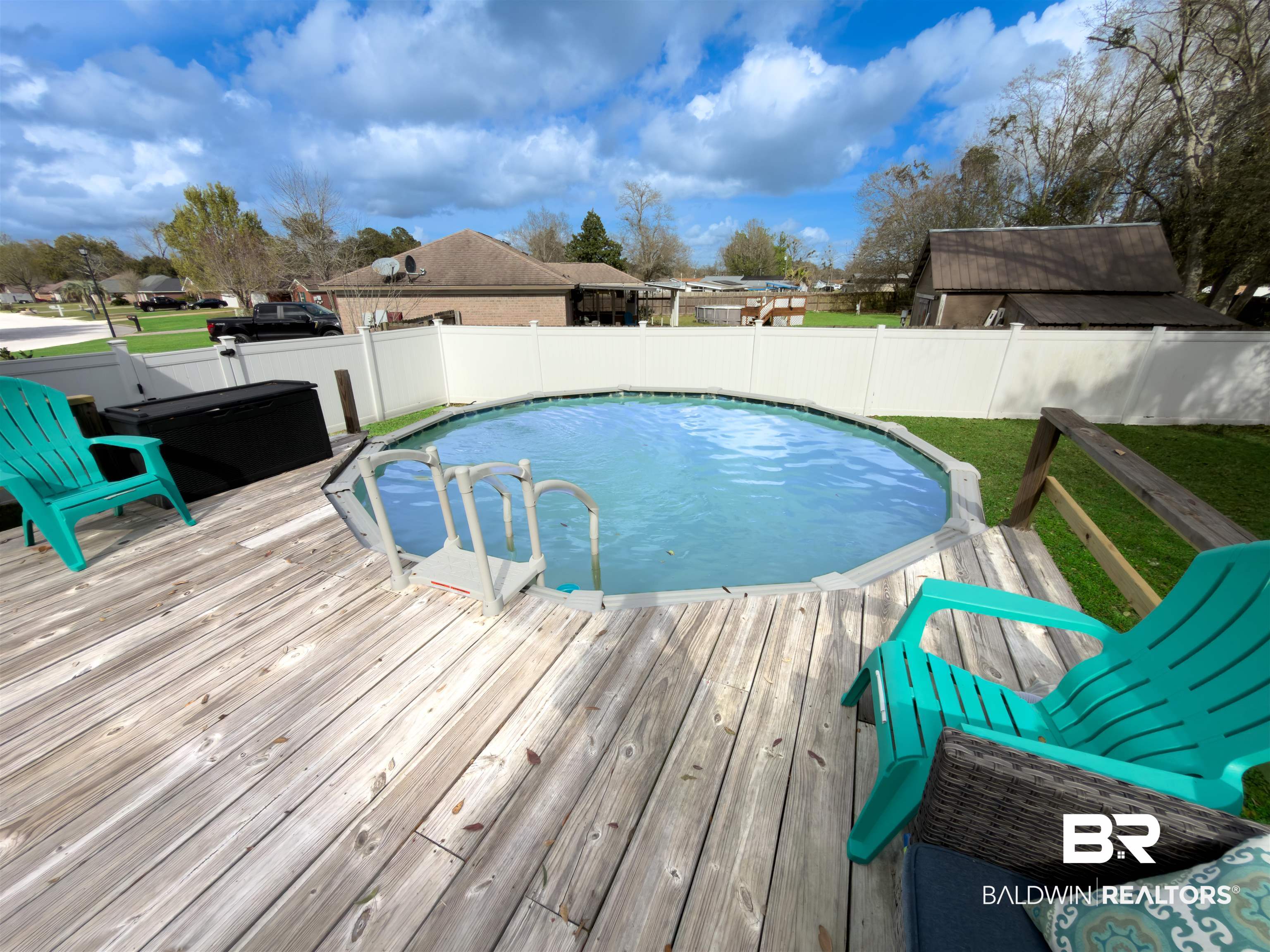 129 Pennbrooke Loop Foley, AL 36535 - Photo 38 of 44 View of pool with a fenced backyard and a deck