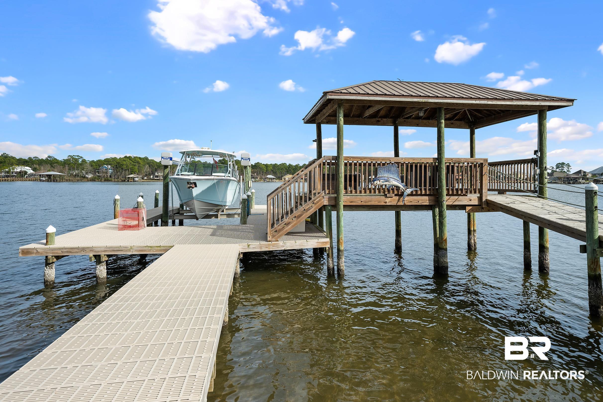 8490 Bay View Drive Foley, AL 36535 - Photo 10 of 67 Dock with boat lift, a water view, and a gazebo