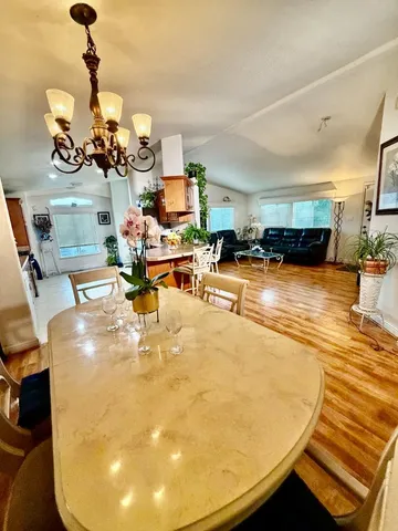 a view of a living room and kitchen
