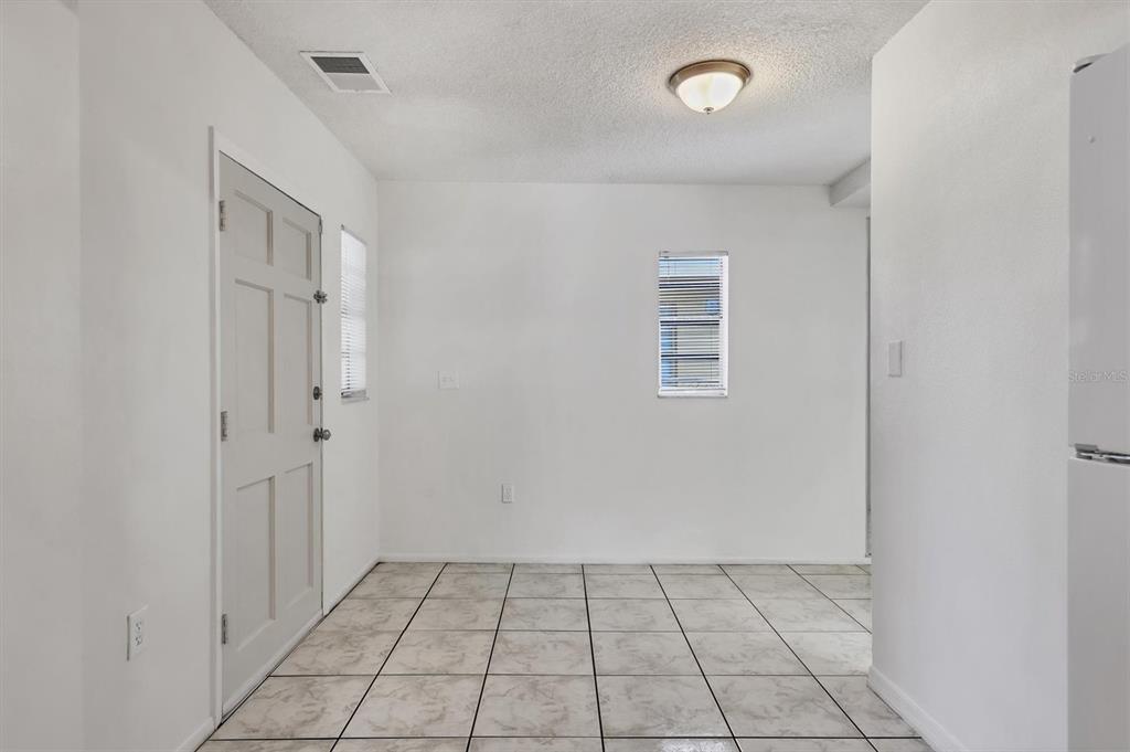 1622 29th Street Sarasota, FL 34234 - Photo 14 of 39 a view of an empty room with closet and a window