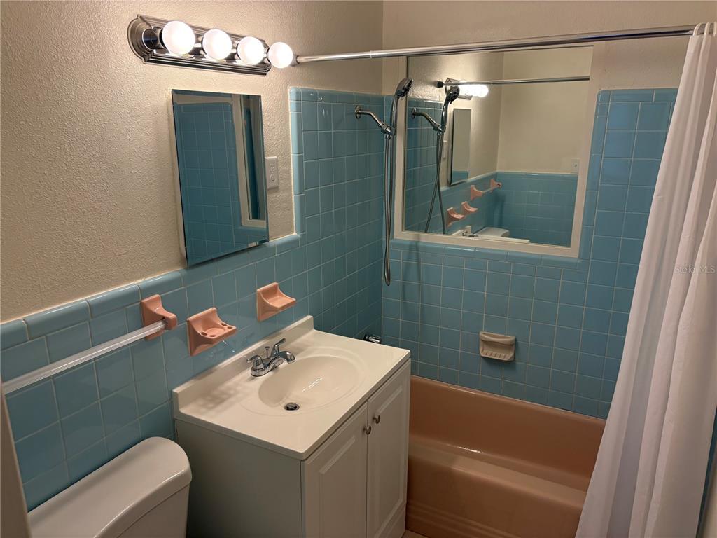 1622 29th Street Sarasota, FL 34234 - Photo 19 of 39 a bathroom with a sink a toilet and shower