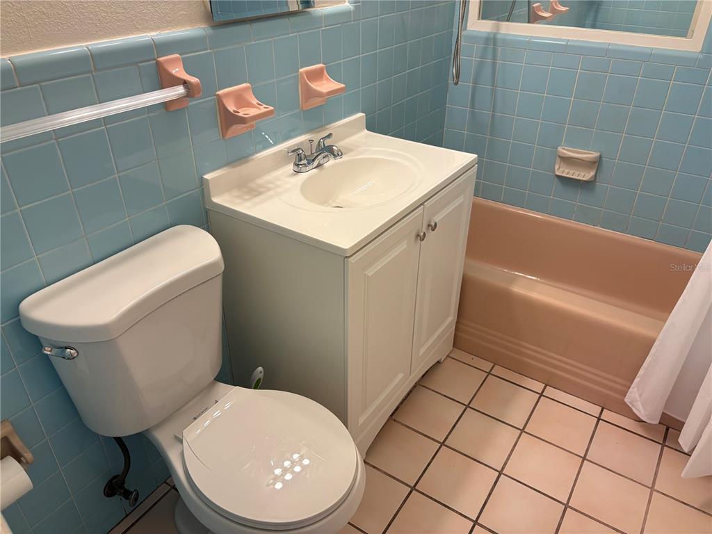 1622 29th Street Sarasota, FL 34234 - Photo 20 of 39 a bathroom with a sink a toilet and a mirror