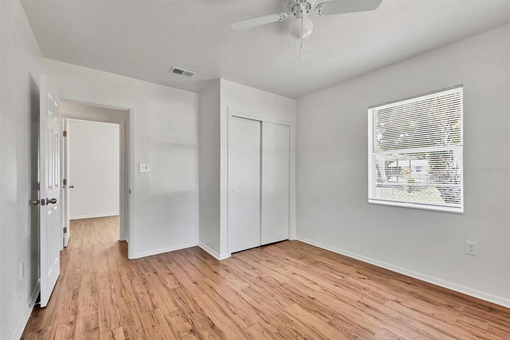 1622 29th Street Sarasota, FL 34234 - Photo 22 of 39 a view of an empty room with wooden floor