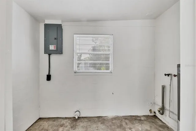 a view of an empty room with windows