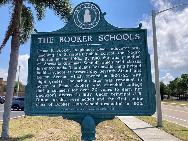 a view of a swimming pool with a table and chairs