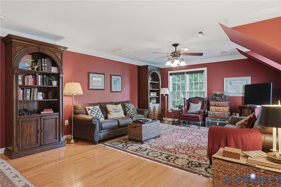 13424 Tipple Point Road Midlothian, VA 23114 - Photo 25 of 53 a living room with furniture and a flat screen tv