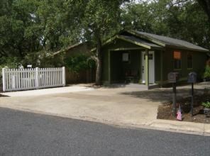 101 Snapper Cove, Unit COTTAG Georgetown, TX 78628 - Photo 1 of 1 a front view of a house with a garden