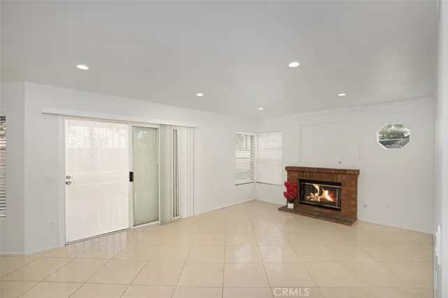 a view of an empty room with a fireplace