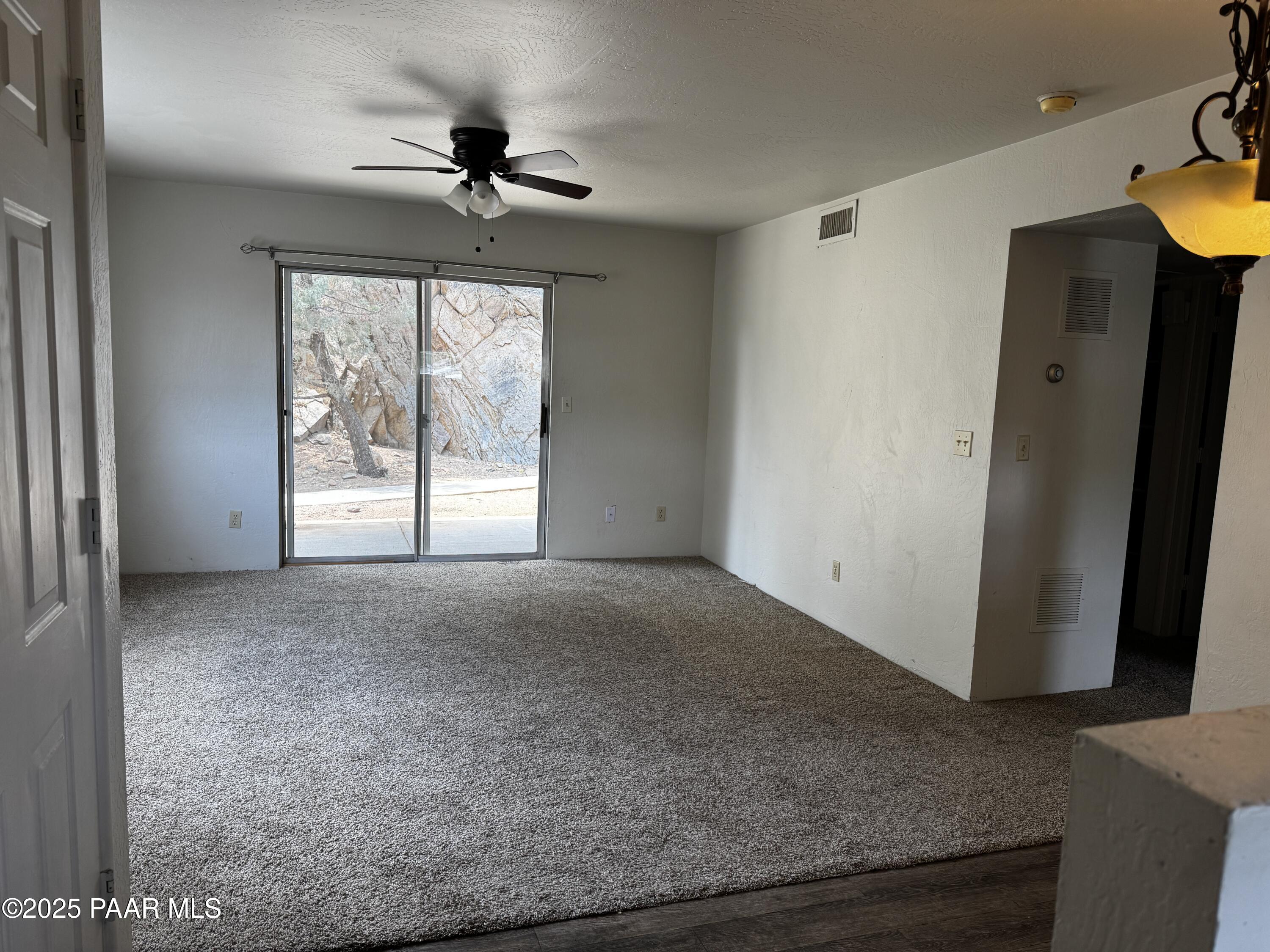 1022 Gail Gardner Way, Unit A Prescott, AZ 86305 - Photo 2 of 6 a view of an empty room with a window
