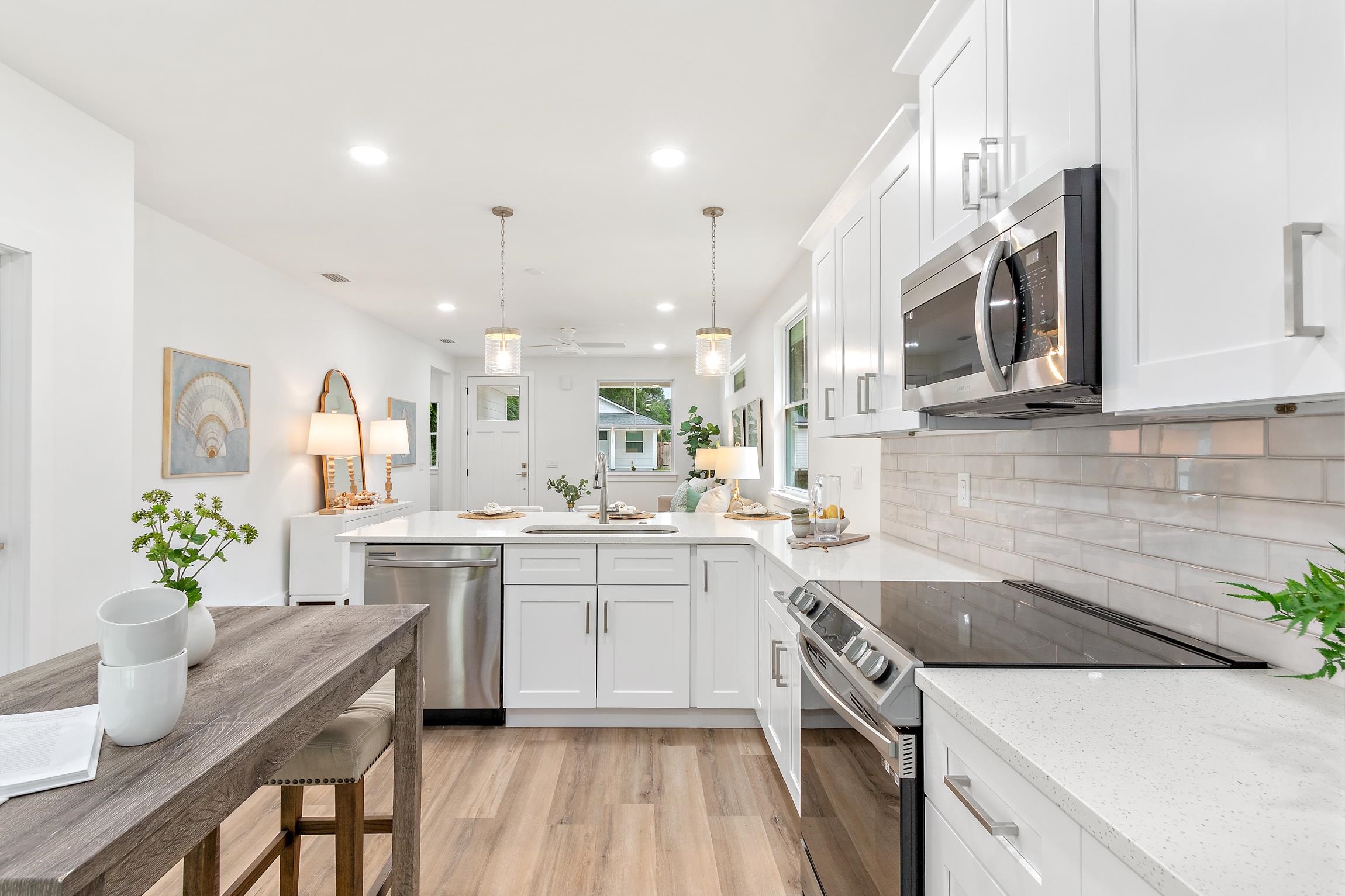 24 River Road St. Augustine, FL 32084 - Photo 12 of 26 a kitchen with a sink stove and cabinets
