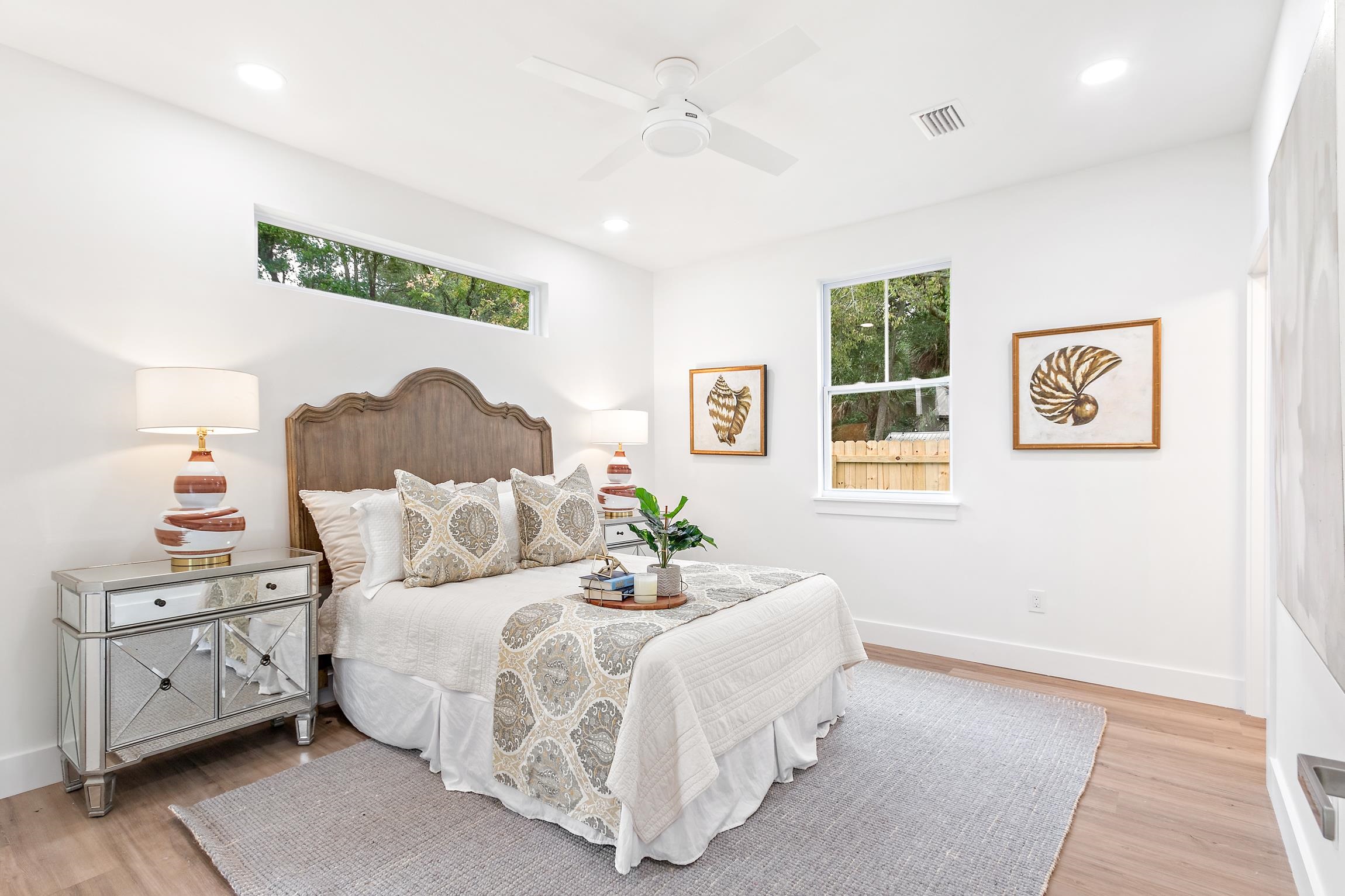 24 River Road St. Augustine, FL 32084 - Photo 13 of 26 a bedroom with a bed and a night stand