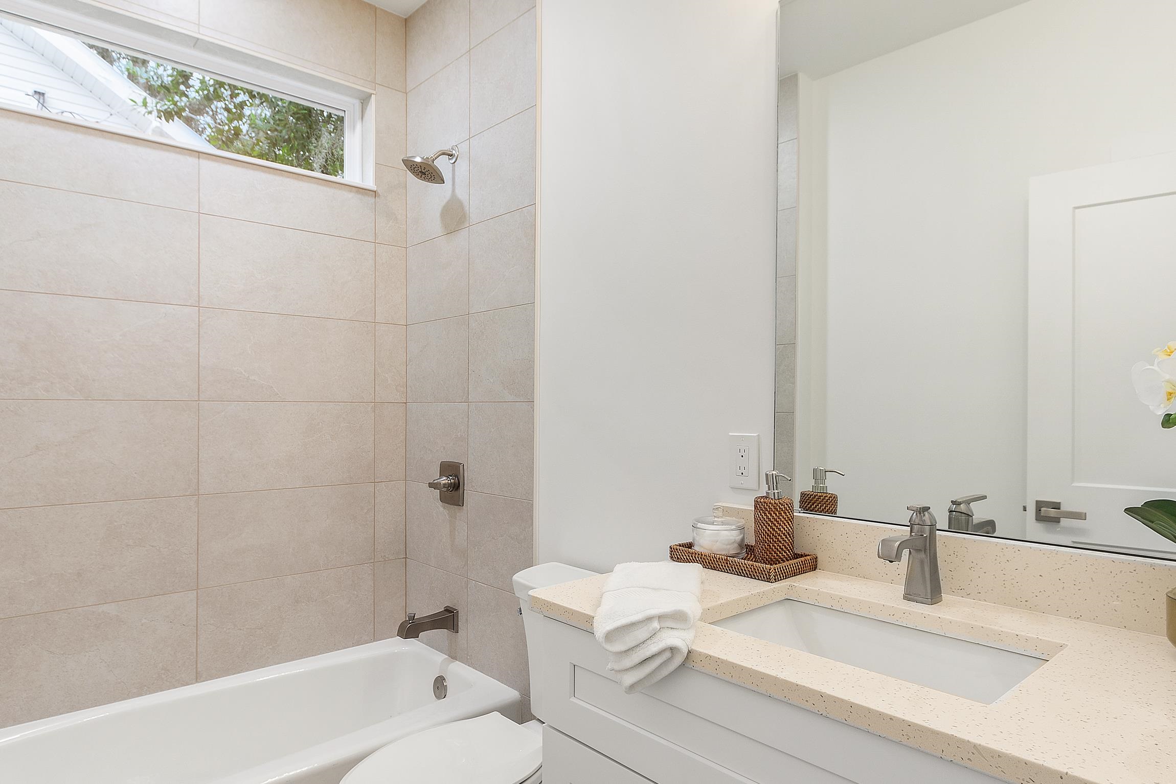 24 River Road St. Augustine, FL 32084 - Photo 19 of 26 a bathroom with a sink and a mirror