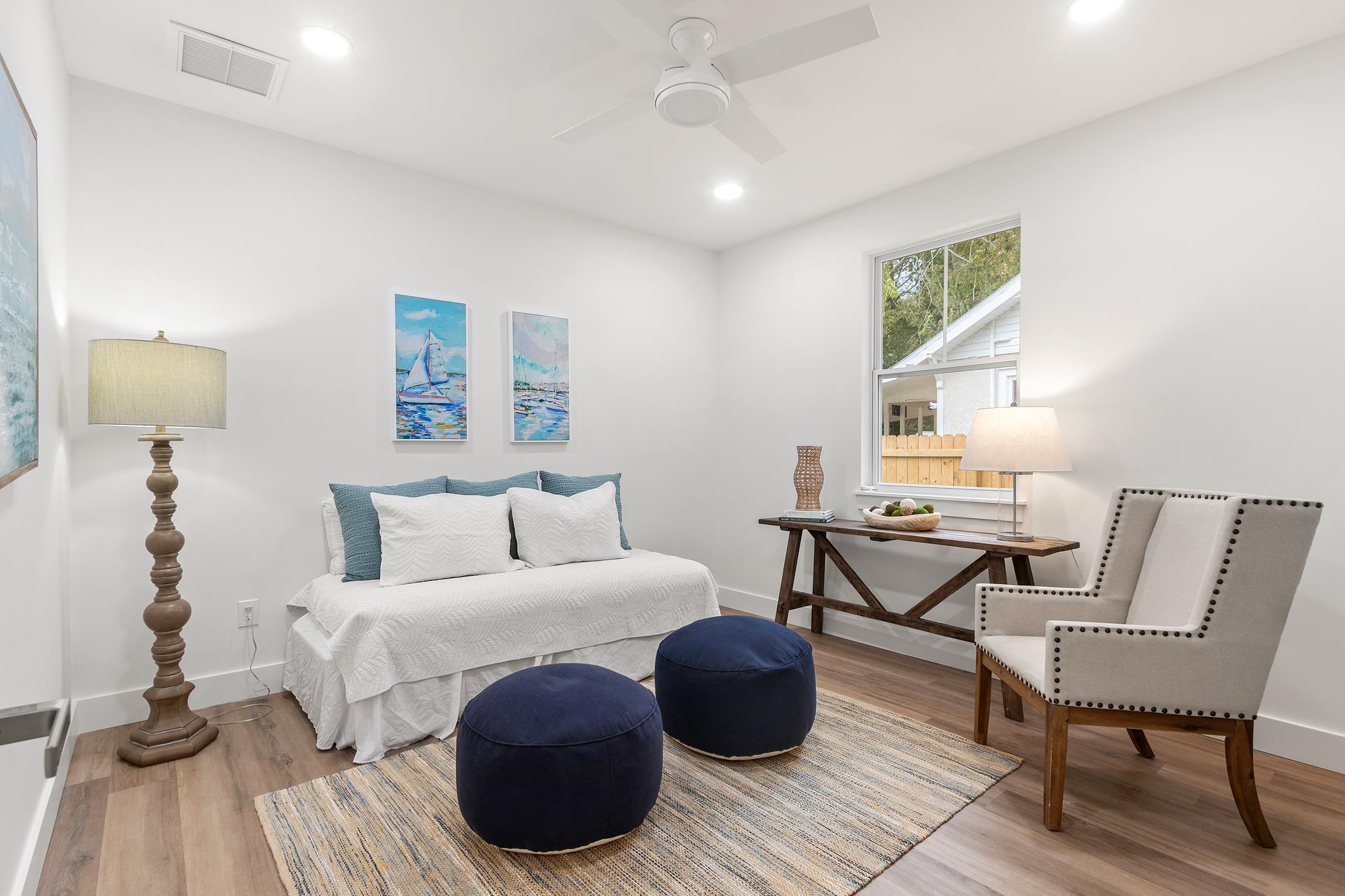 24 River Road St. Augustine, FL 32084 - Photo 20 of 26 a bedroom with furniture and a wooden floor