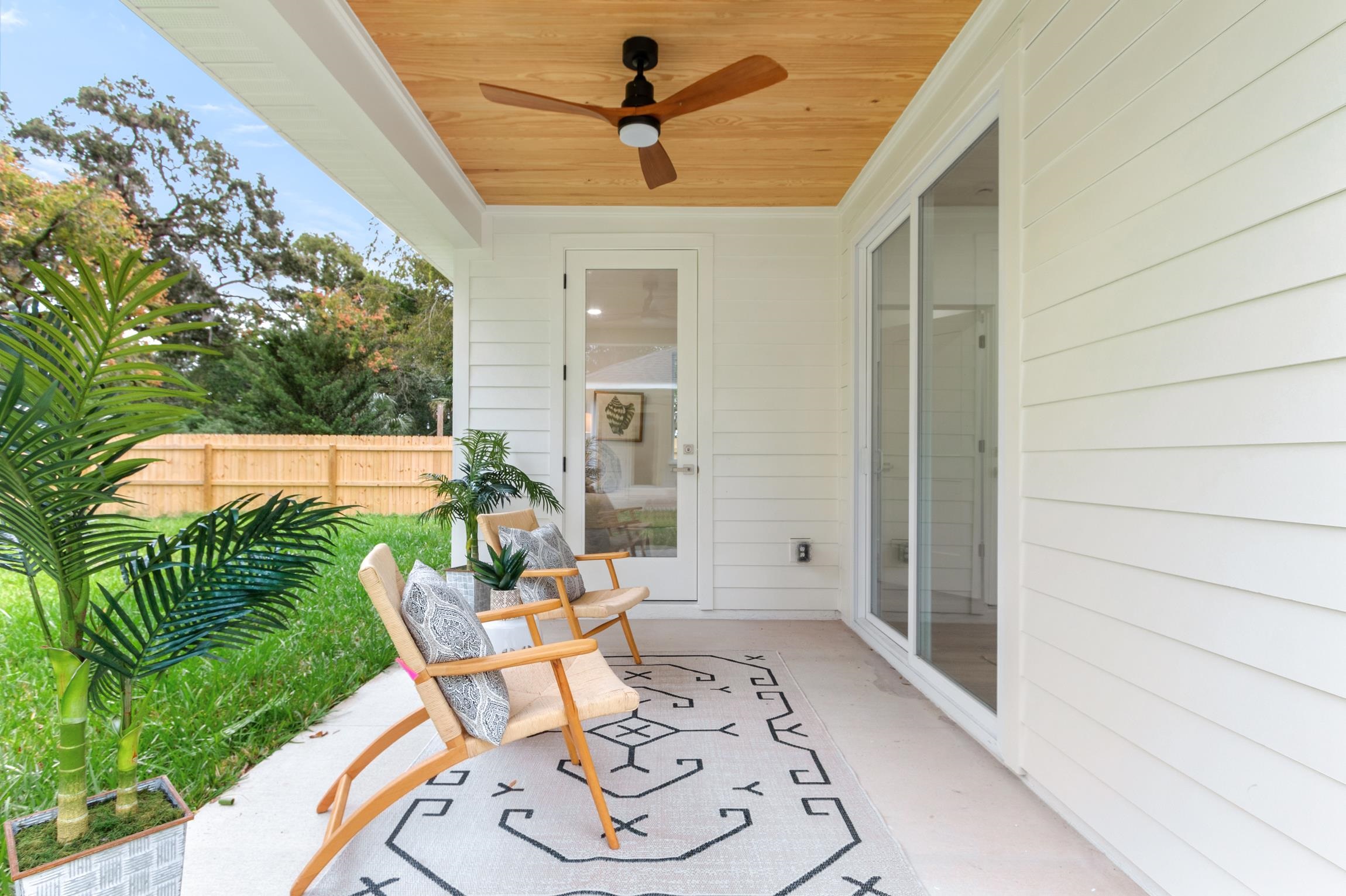 24 River Road St. Augustine, FL 32084 - Photo 23 of 26 a patio with yard glass top table and chairs